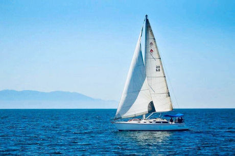 Sailboat with open sails