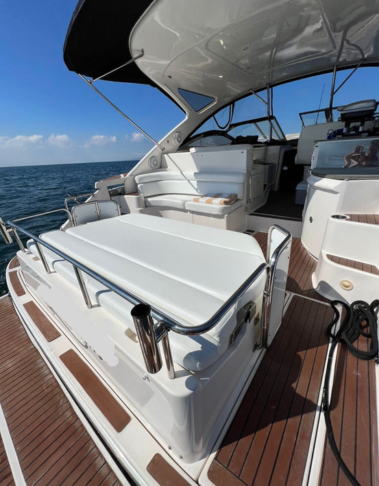 Seating area on a yacht all in white
