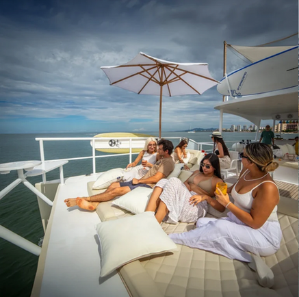 people sitting on a catamaran deck