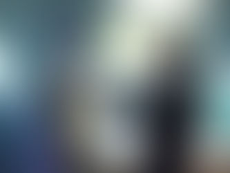 A mondasian cyberman, robot with cloth face, stood in front of the Doctor. The Doctor is placing his hand on the Cybermans chest. This is Bill, converted