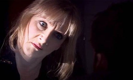 Close up of Sky's face, cocked head, creepy eyes