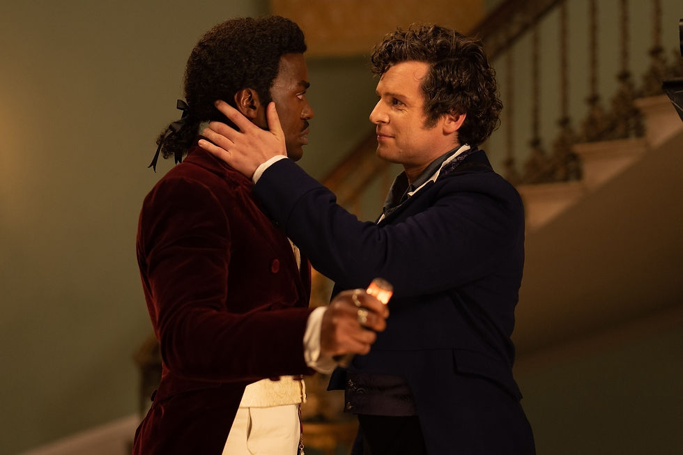 The Doctor and Rogue looking at each other, Rogue has his hand on the side of the Doctor's face, tender
