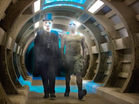 Two ghosts walking towards the camera in a corridor