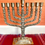 Thumbnail: Large Brass Hanukkah Menorah with 12 Signs of Israel's Tribes - Majestic Cente