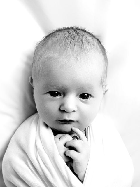 Adorable newborn baby in swaddle