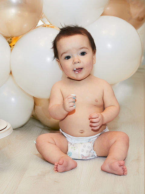 Baby boy's first birthday cake smash