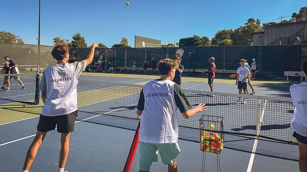 Volunteers feed balls to players during the first ACEing Autism class on Oct. 3 at Strawberry Recreation District. Athletes practiced forehands and backhands, and the class ended with a game of red light, green light. (Tyler Callister / The Ark)