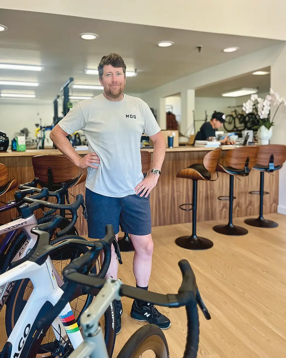 Peter Lucas opened Marin Service Course at The Boardwalk shopping center July 25, the second location for the bike shop he founded in Fairfax in 2019. Lucas, who grew up on Centro West Street riding to Del Mar Middle School, built the store around a bar, at rear, where customers can drink free espresso and watch races. (Tyler Callister / The Ark)