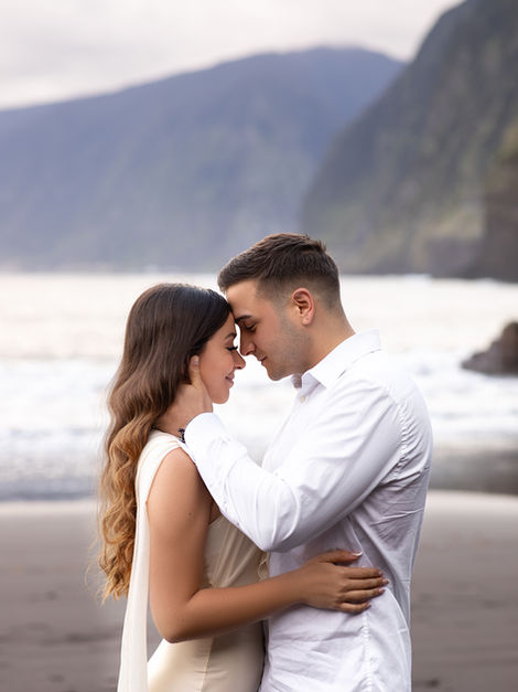 Couple photoshoot on Seixal Beach in Madeira capturing a romantic moment by the ocean