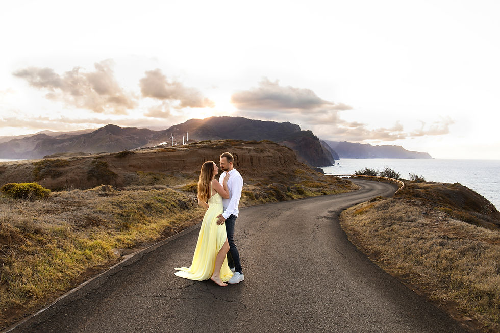 Couple enjoying a private honeymoon photoshoot at Ponta do Rosto during sunset in Madeira