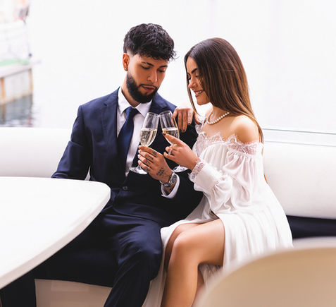 Couple toasting on a luxury yacht tour in Madeira