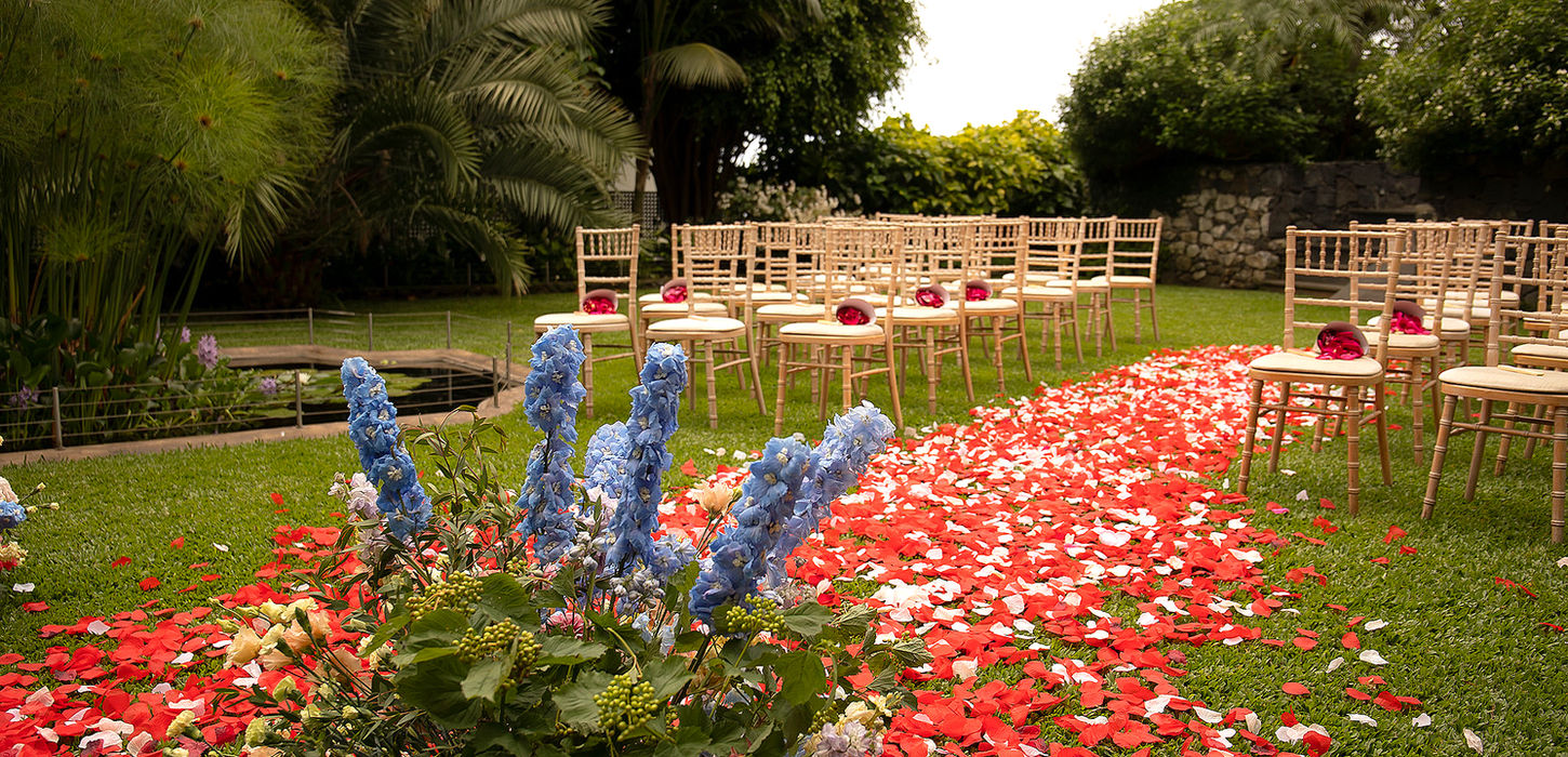 wedding ceremony setup in Madeira with floral aisle and outdoor garden decoration