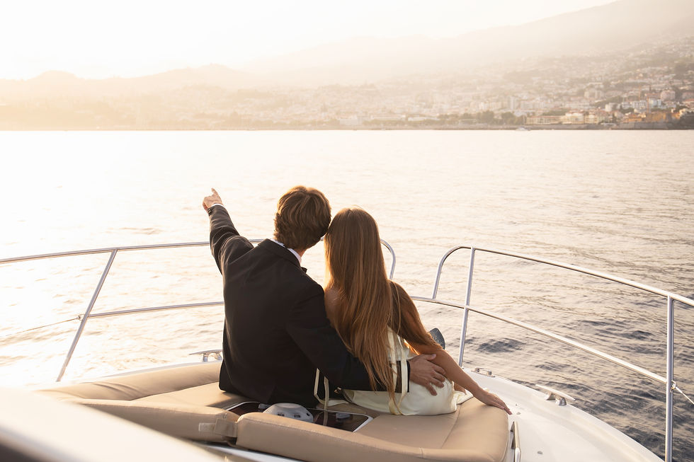 Couple enjoying a private luxury yacht proposal in Madeira during sunset with breathtaking Atlantic Ocean views.