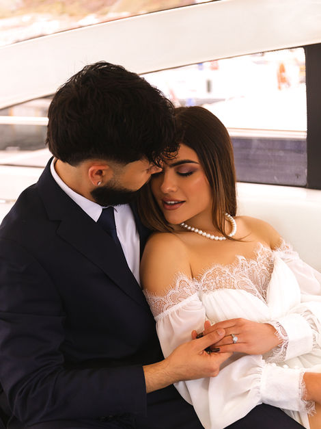 Romantic wedding photography in Madeira with an elegant couple sharing an intimate moment aboard a luxury yacht.