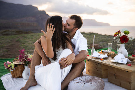 Cinematic picnic moment with blankets, décor, and fresh fruits on Madeira cliffs