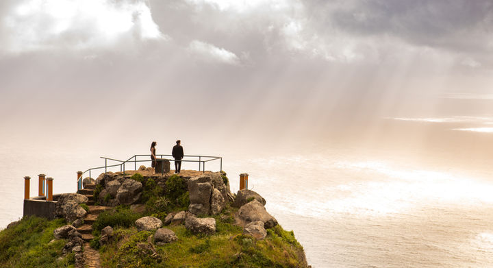 Romantic couple at an ocean viewpoint during a marriage proposal experience in Madeira