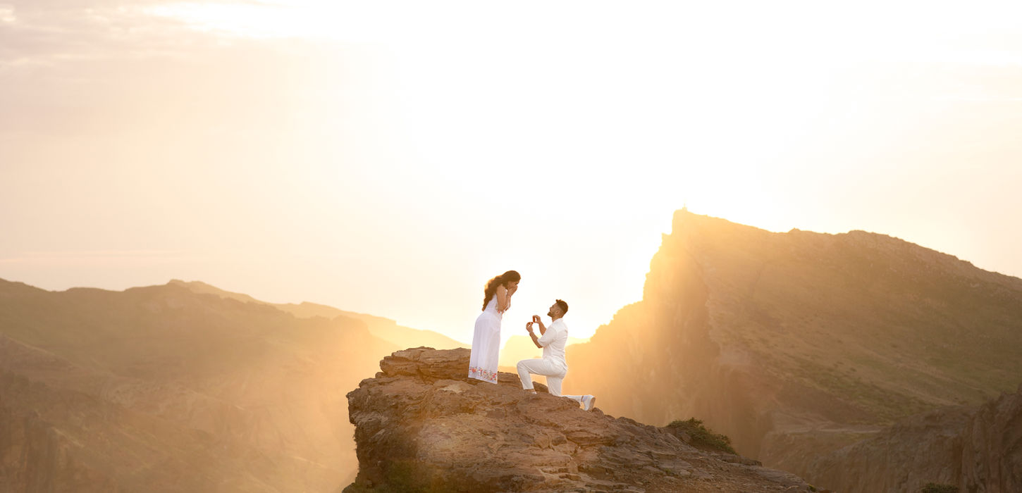 Man proposing to his partner at Pico do Arieiro during a romantic marriage proposal in Madeira