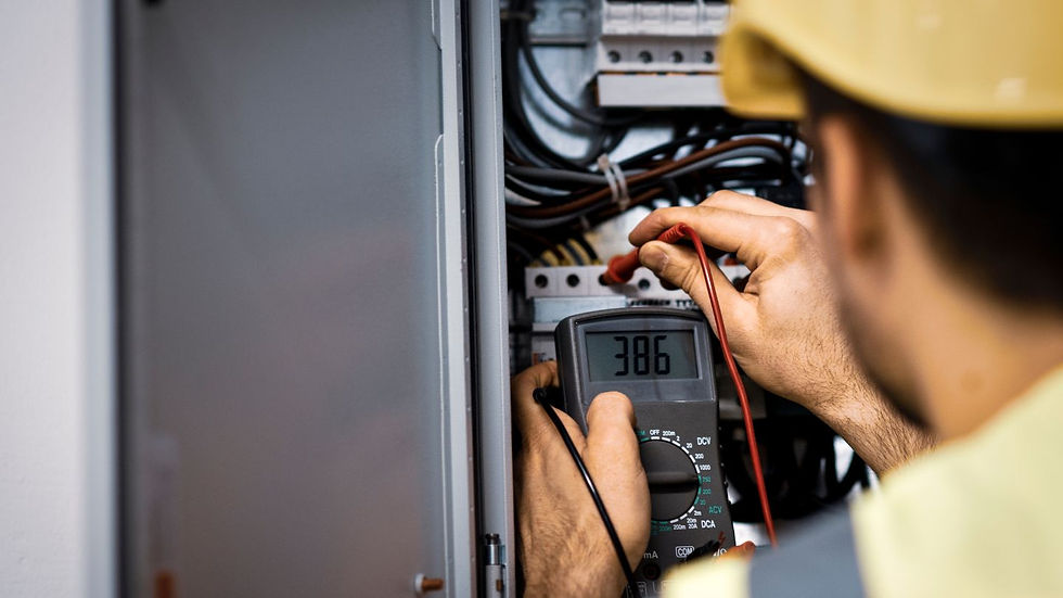 picture of professional electrician working on a electrical panel