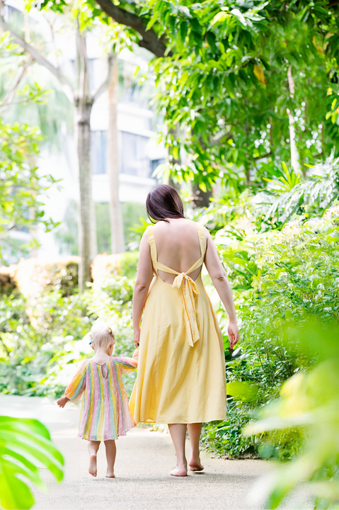 Mother and daughter walking in condo gardens – family photography Singapore
