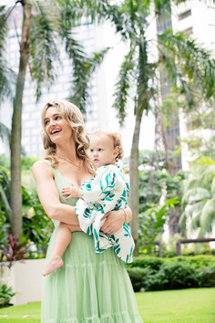 Outdoor family photoshoot at Singapore Botanical Gardens capturing mother and baby  in a natural setting