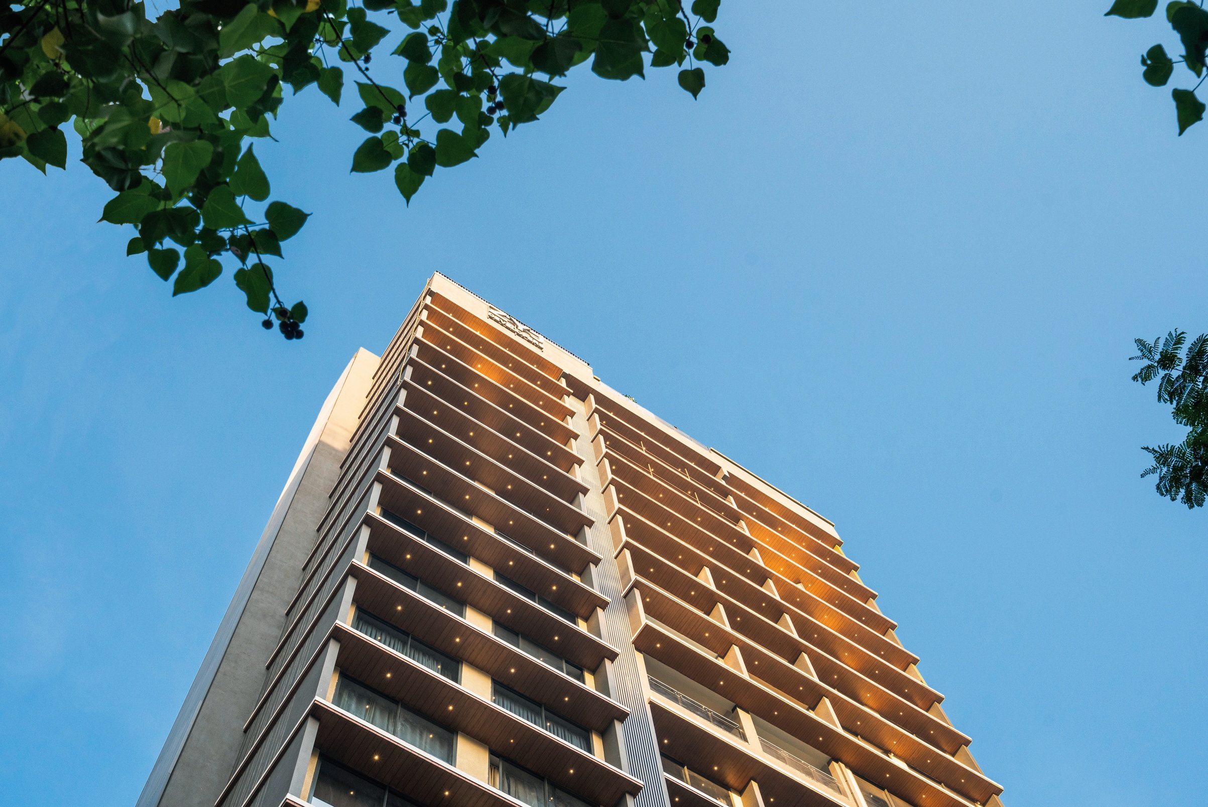 Sequoia completed exterior, balconies and roofline framed against the sky