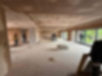 Freshly plastered ceiling and walls in a large room.
