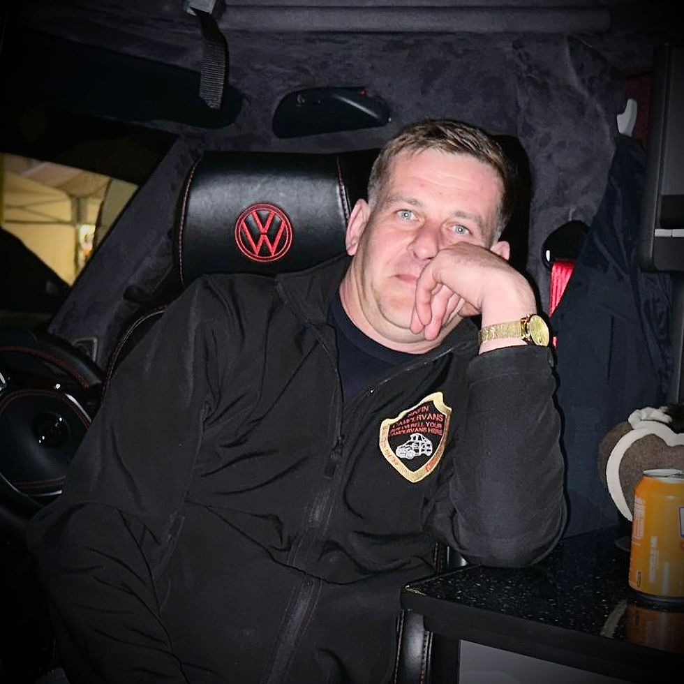 Man in Volkswagen campervan, Sinfin Campervans logo