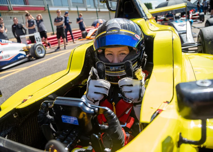 Bright yellow Elite Motorsport GB4 single-seater car on track at Silverstone