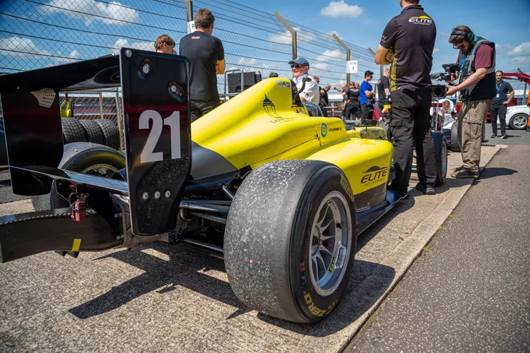 Drivers Alisha Palmowski and Fin Harrison in the Elite Motorsport garage at Silverstone