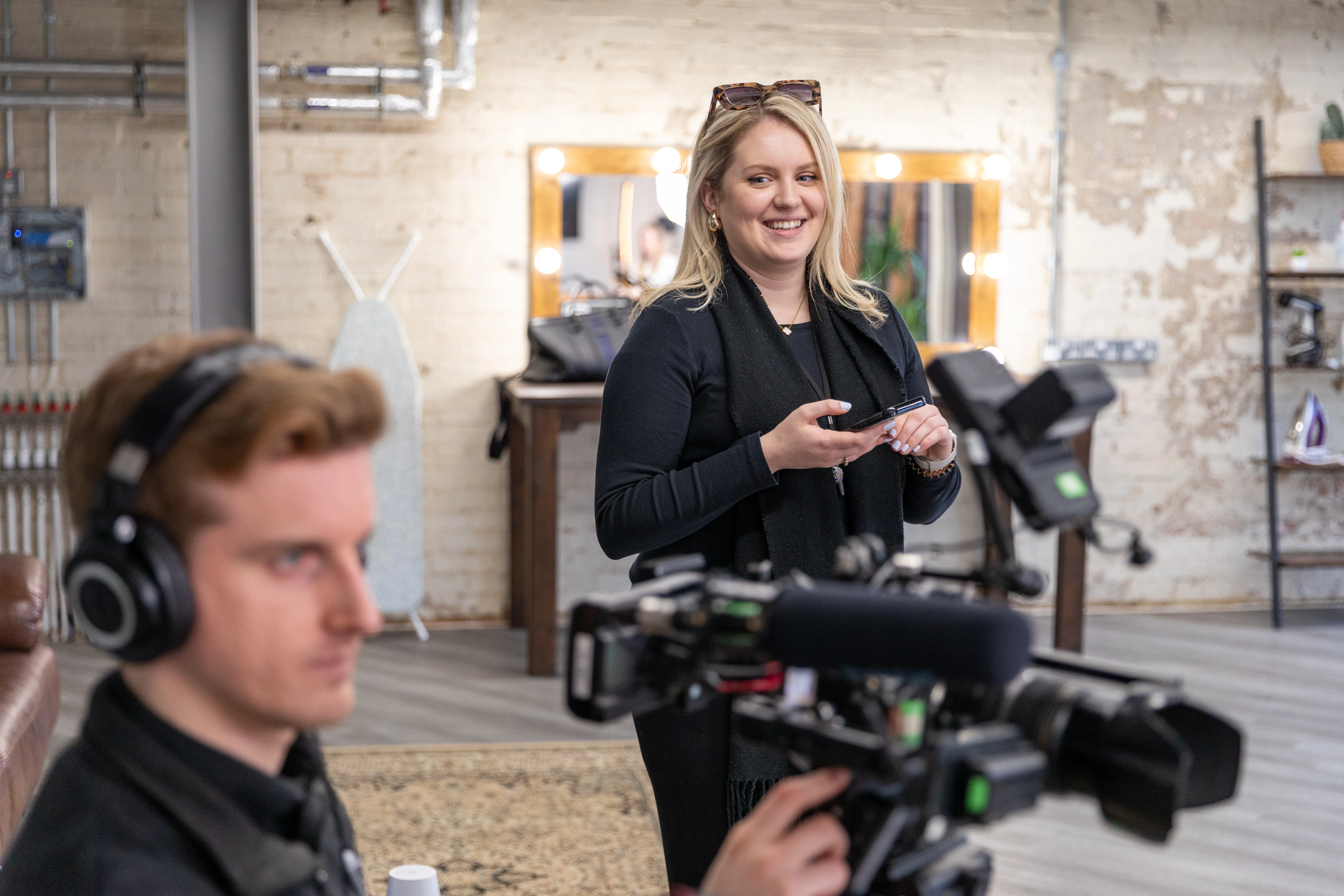 Film crew capturing content on set at Lamplight Media
