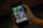 Person viewing family photo on phone
