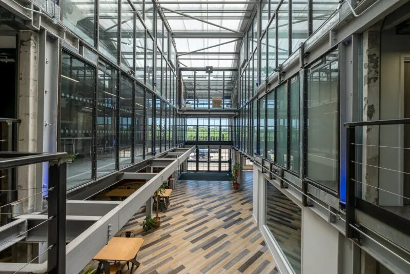 Neo-industrial atrium with coffee shop inside the Tannery Studio office building