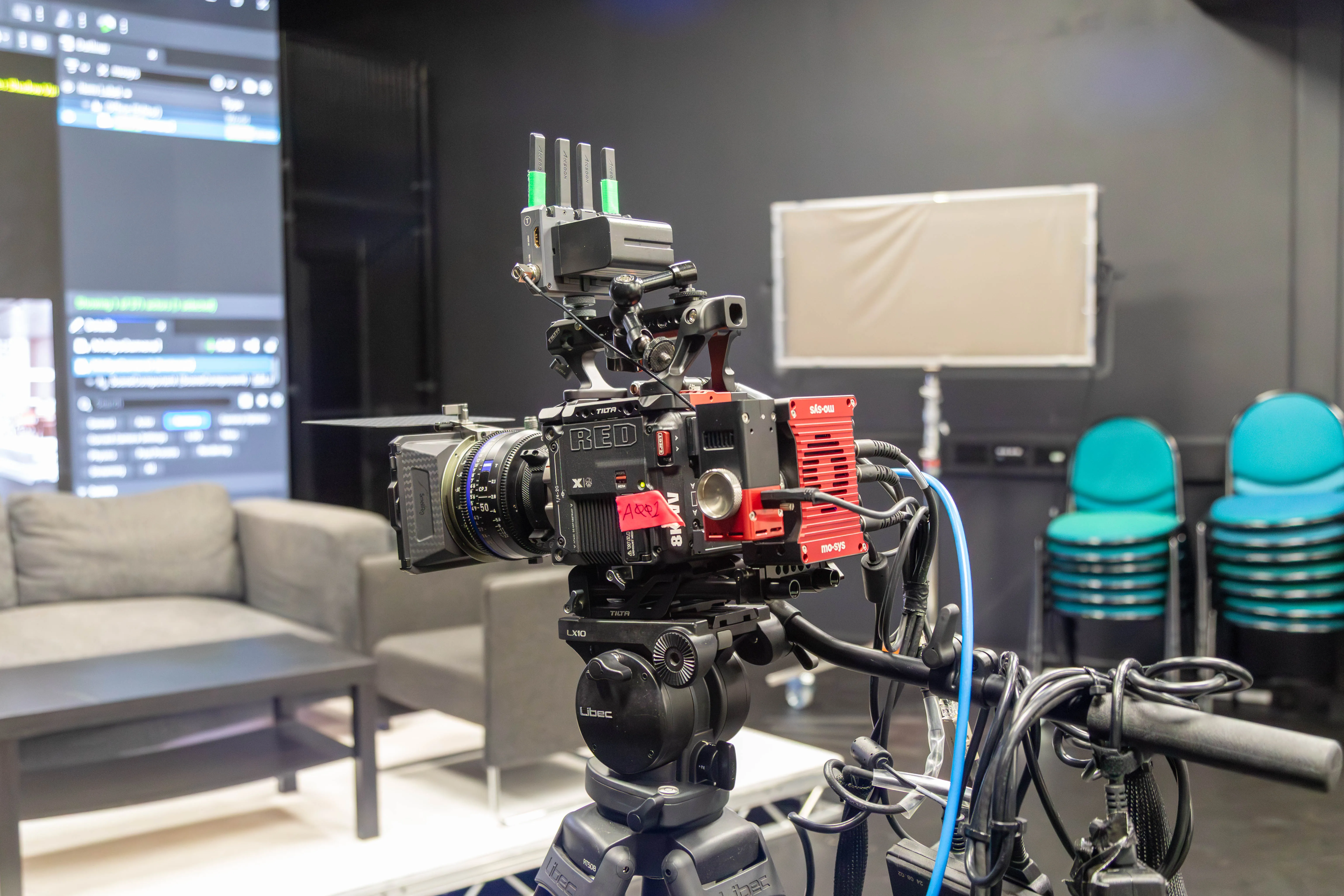 Camera operator framing a shot in front of the LED virtual production wall