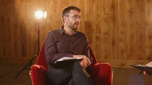 On-camera fireside chat between Business Surrey advisors during filming