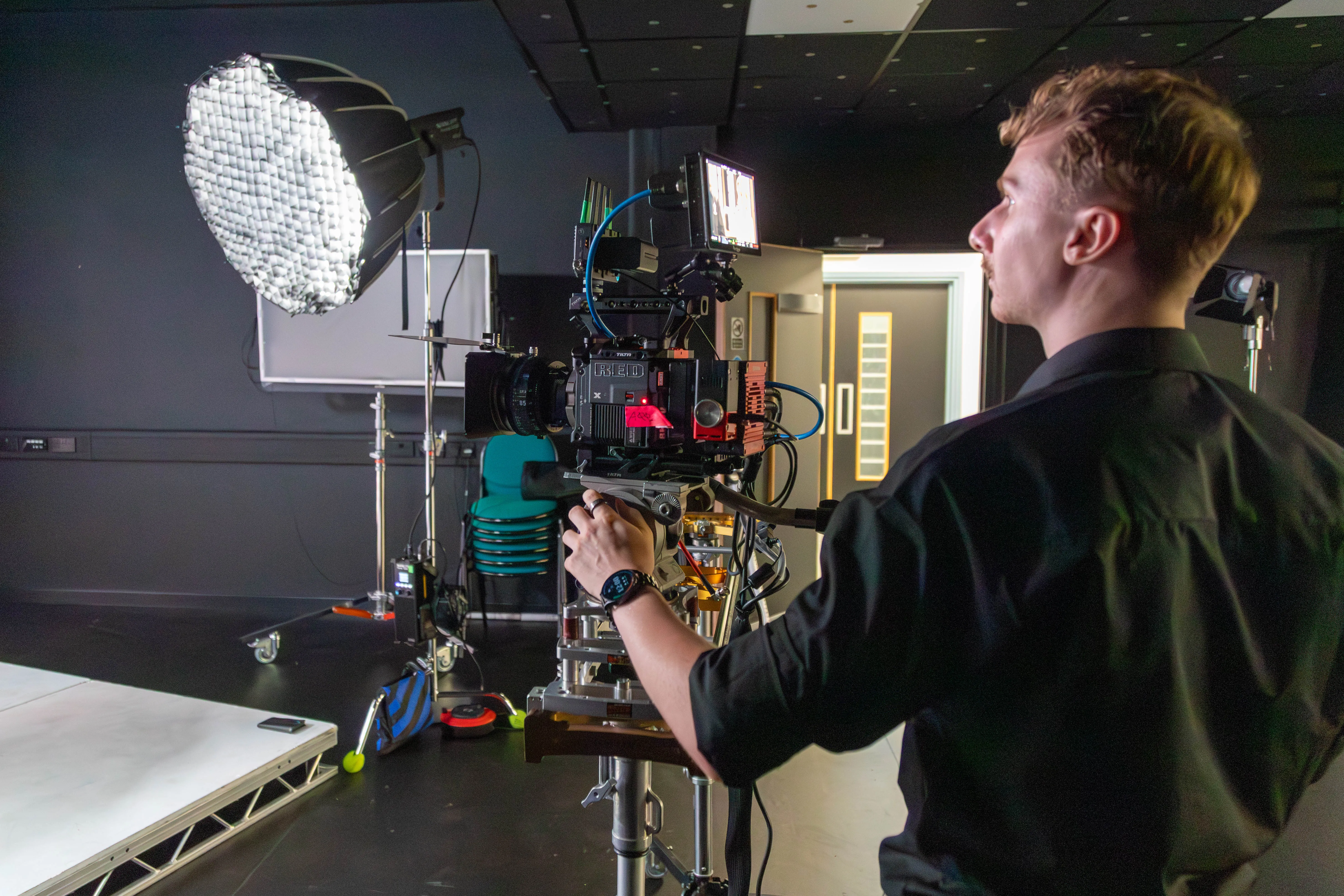 Camera moves on a slider capturing a product against a virtual backdrop