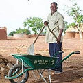 man holding tools on farm