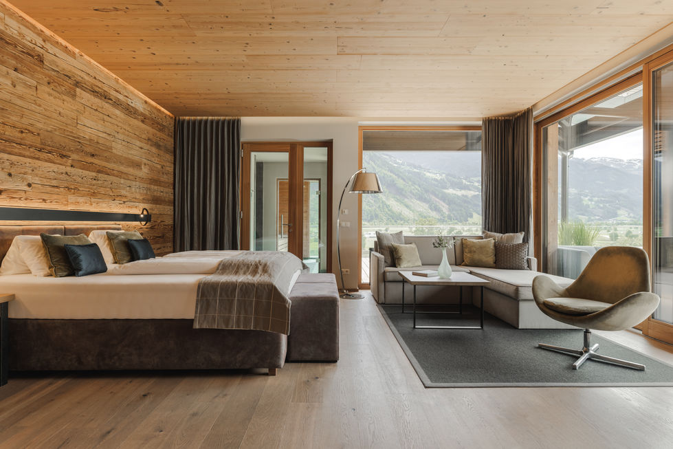 a hotel room with a large bed and a couch