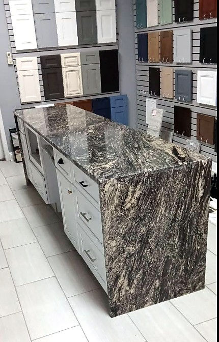 A Plus Ocean Springs showroom cabinet displays and waterfall stone island