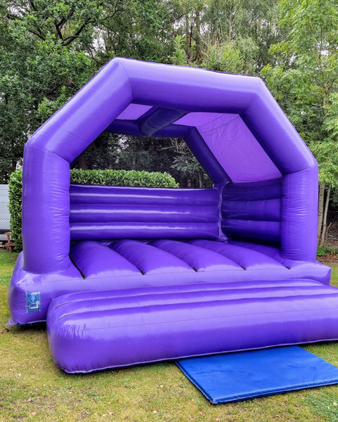 Purple Adult Castle, a adult bouncy castle for hire from Top Banana Bouncy Castles