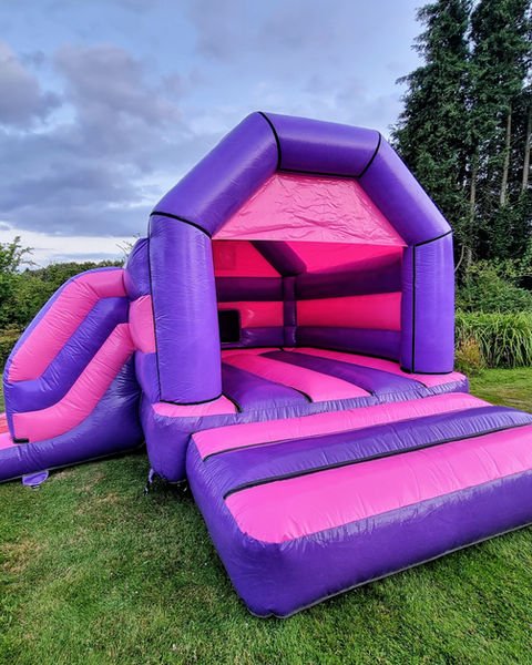 Pink And Purple Combo, a bouncy castle for hire from Top Banana Bouncy Castles