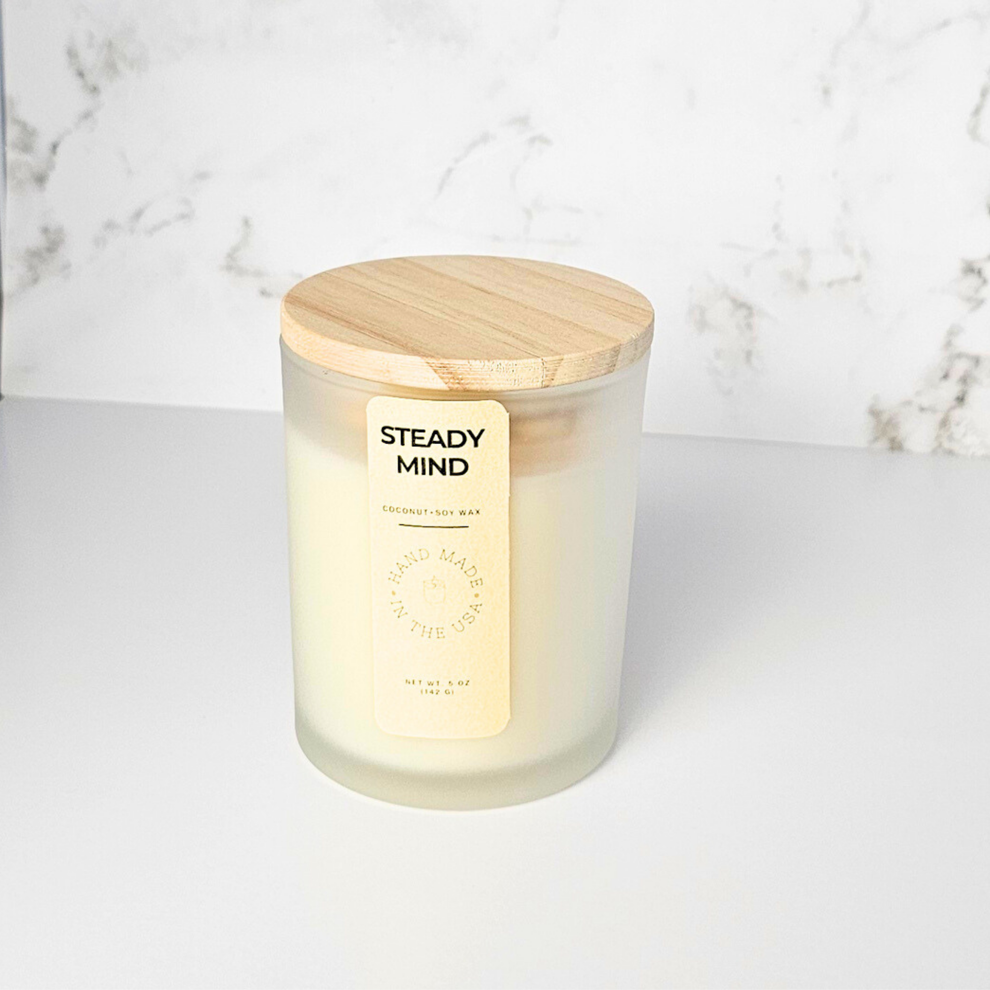 wickless candle in front of marble background