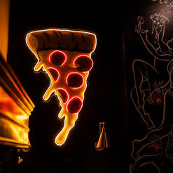 Pizza Lab interior artwork and neon pizza sign