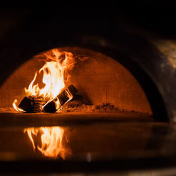 Inside the wood-fired pizza oven