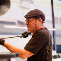 Pizza chef putting pizza in oven