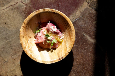 A bowl of carrot tartare in the sun
