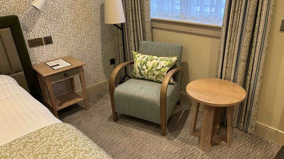 Target Furniture Ltd contract furniture at Piersland House Hotel, featuring a hotel armchair and oak side table.