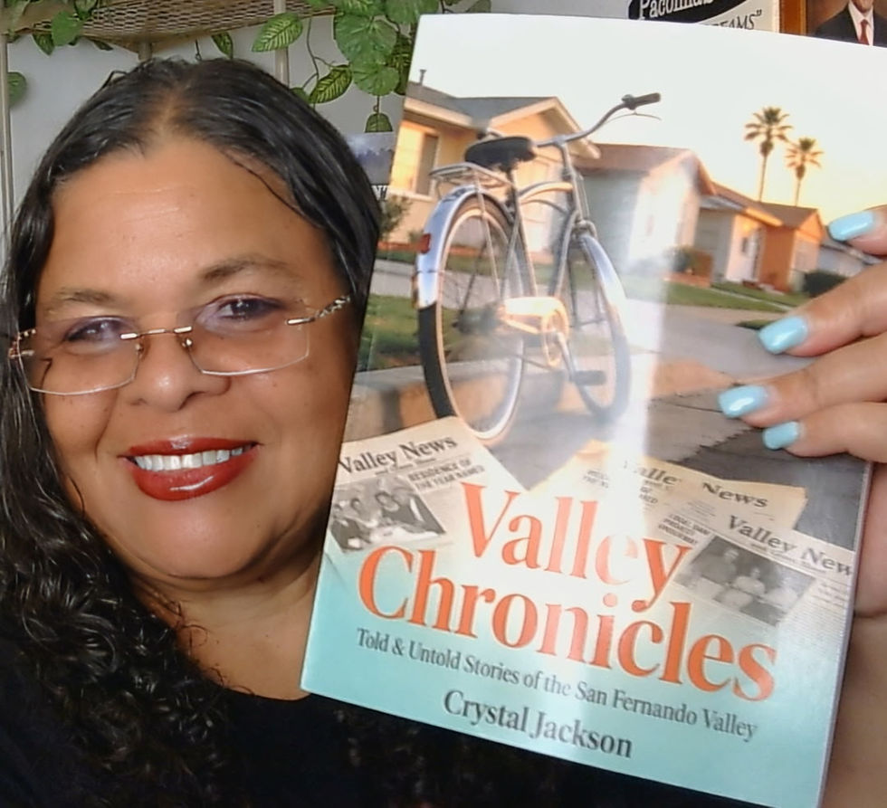 Historian and author Crystal Jackson holds her new book, Valley Chronicles: Told and Untold Stories of the San Fernando Valley