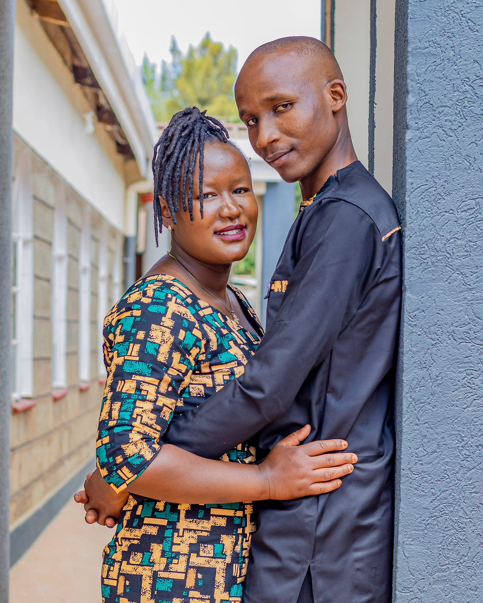 Truthvision Media couple embracing and smiling outdoors.