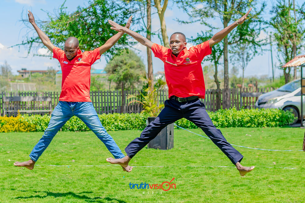 Two men in red shirts jumping by TruthVision Media