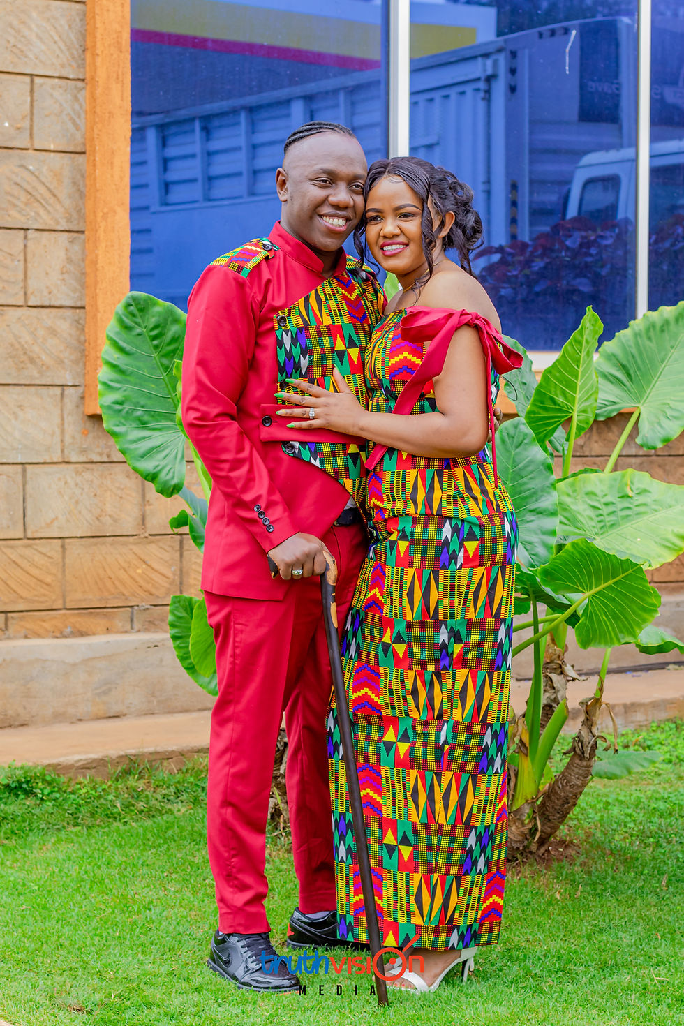 Smiling couple in African attire for TruthVision Media.
